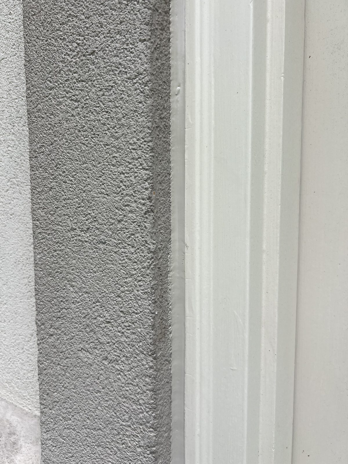 Sealed stucco band with crisp paint line