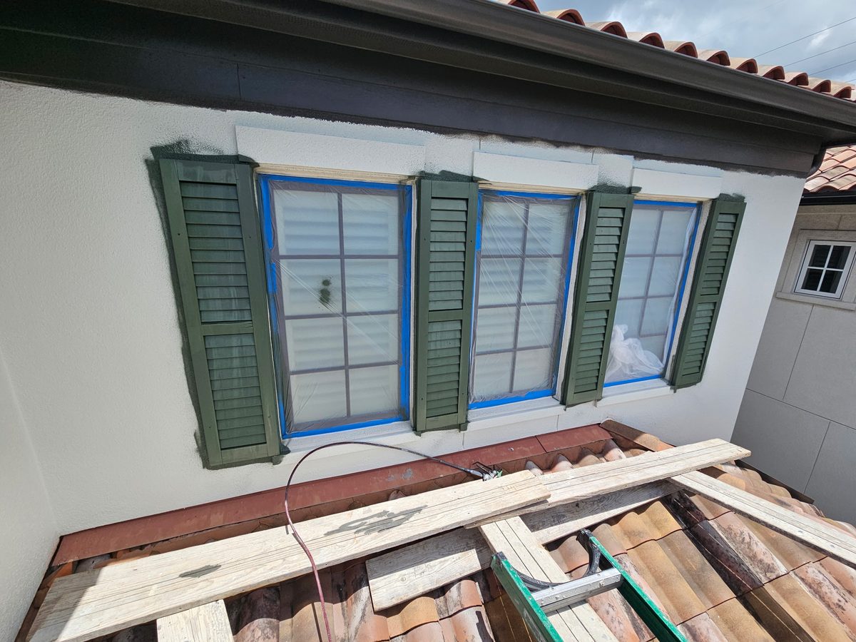 Green shutters and window trim refinished