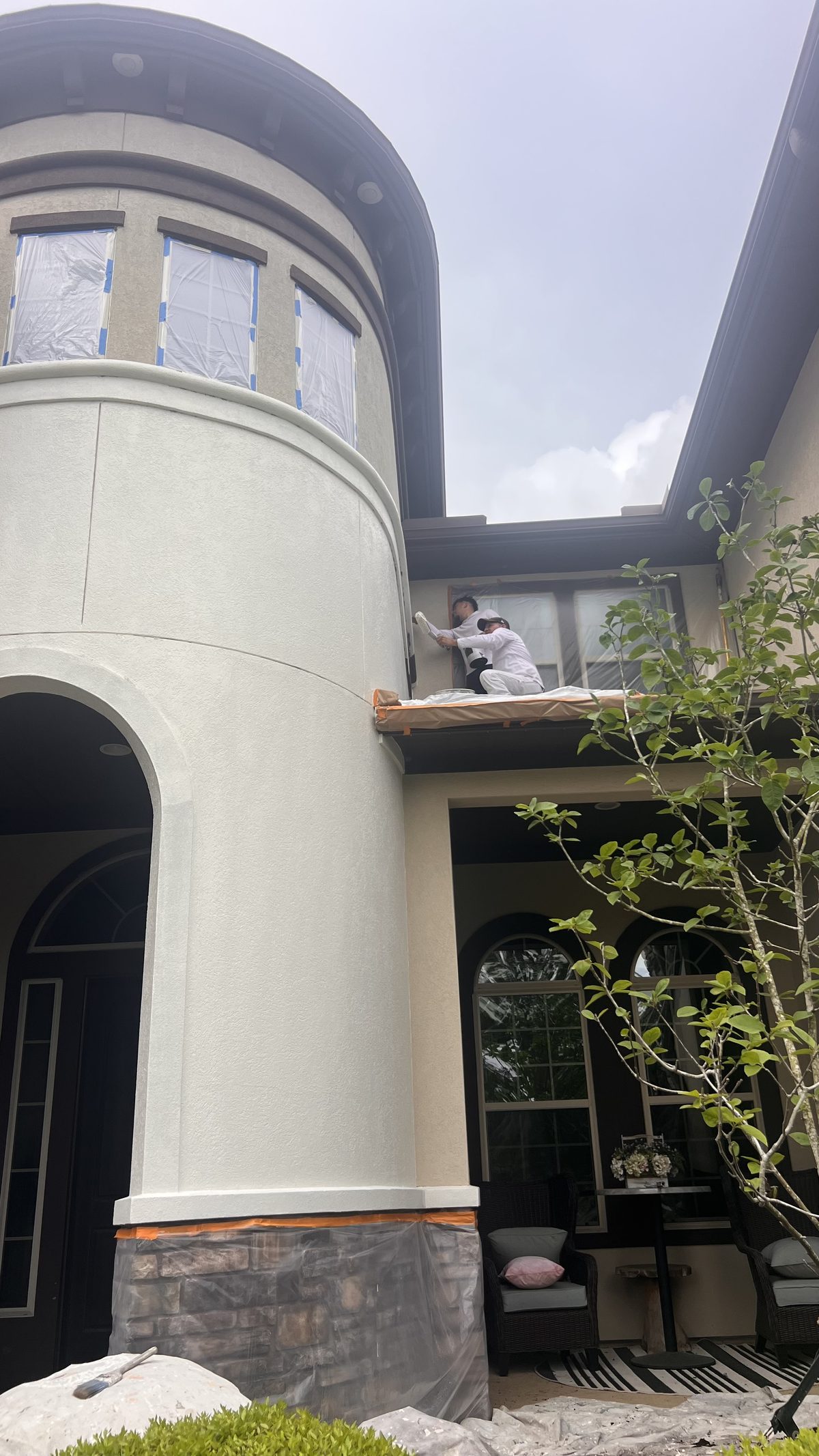 Tower wall finished around stone accents